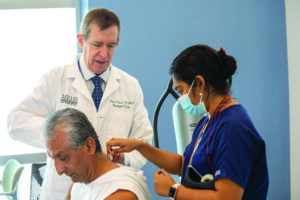 Dr. Guest in his lab studying transcutaneous stimulation.